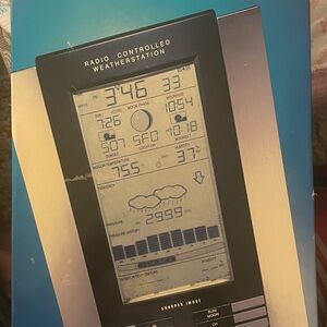 Sharper Image Wireless Sun/Moon Weather center w/ Radio Controlled Atomic Clock